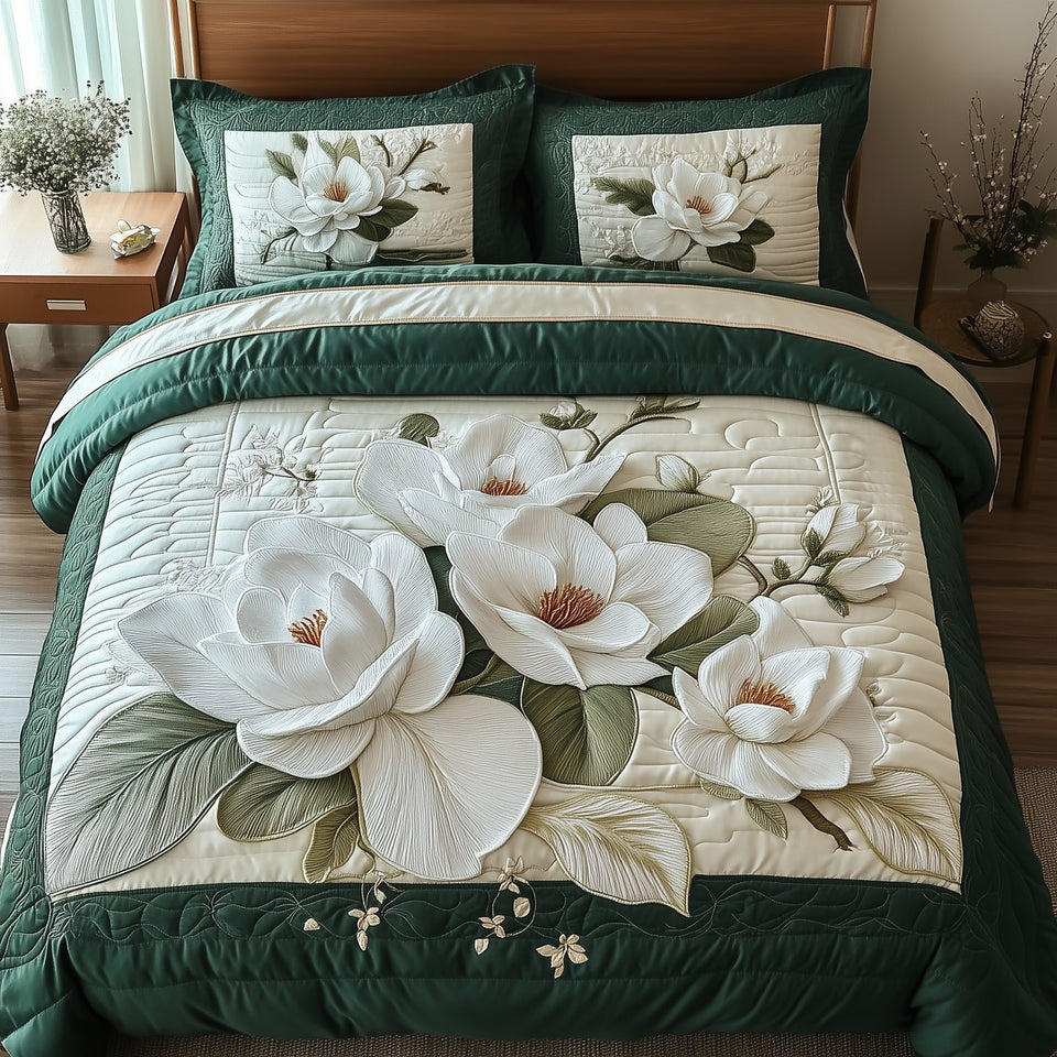 Elegant Blooming Magnolia Wide Petals on Pearl quilted bedding set, quilt and two pillow shams on a made bed