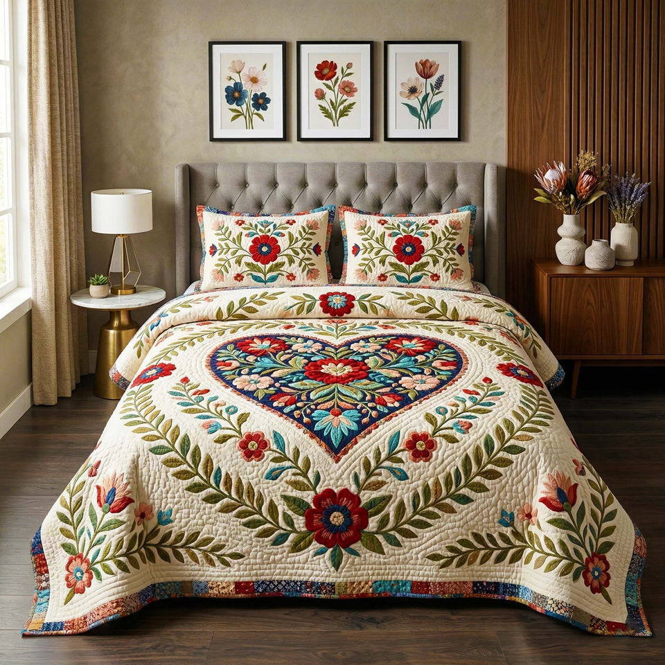 Elegant Folk Heart quilted bedding set, quilt and two pillow shams on a made bed