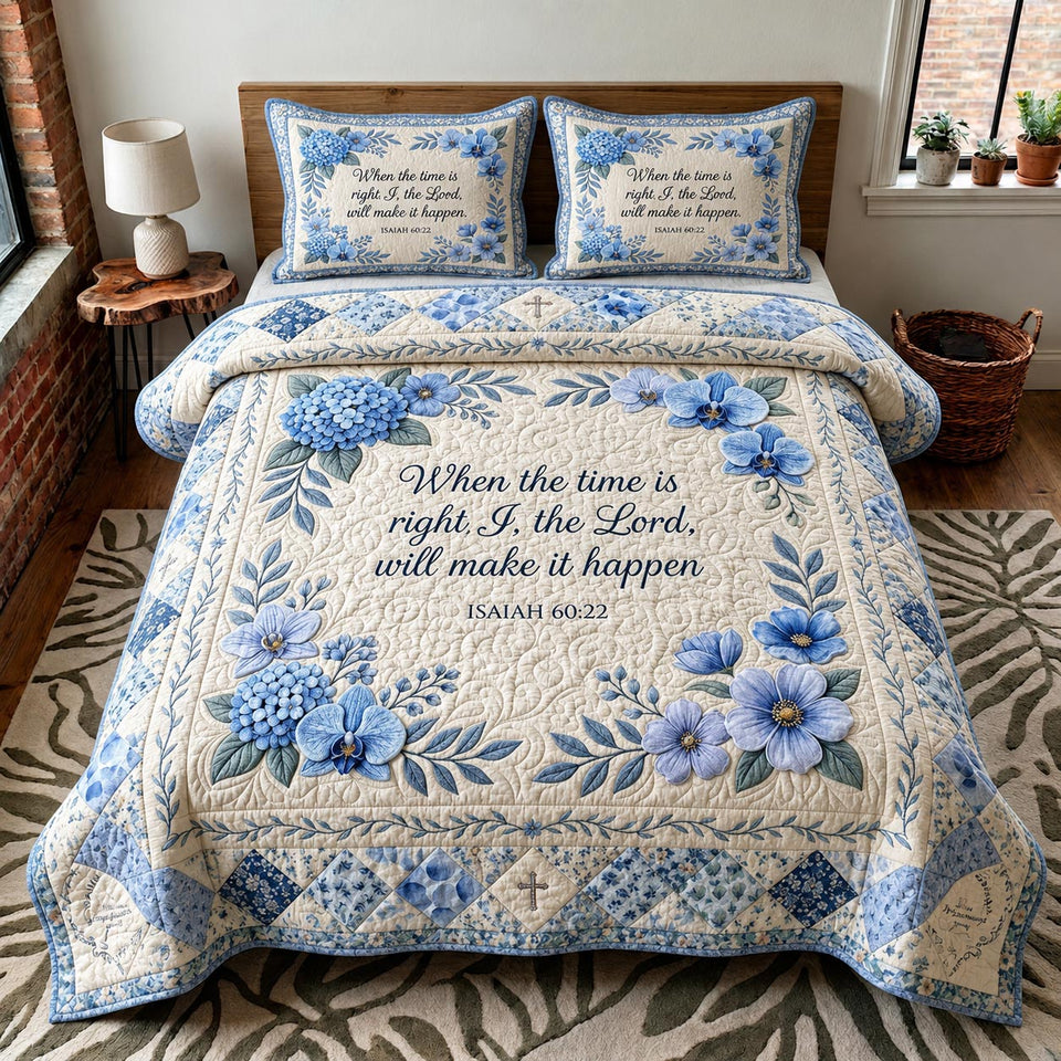 Faith Blossom quilted bedding set, quilt and two pillow shams on a made bed