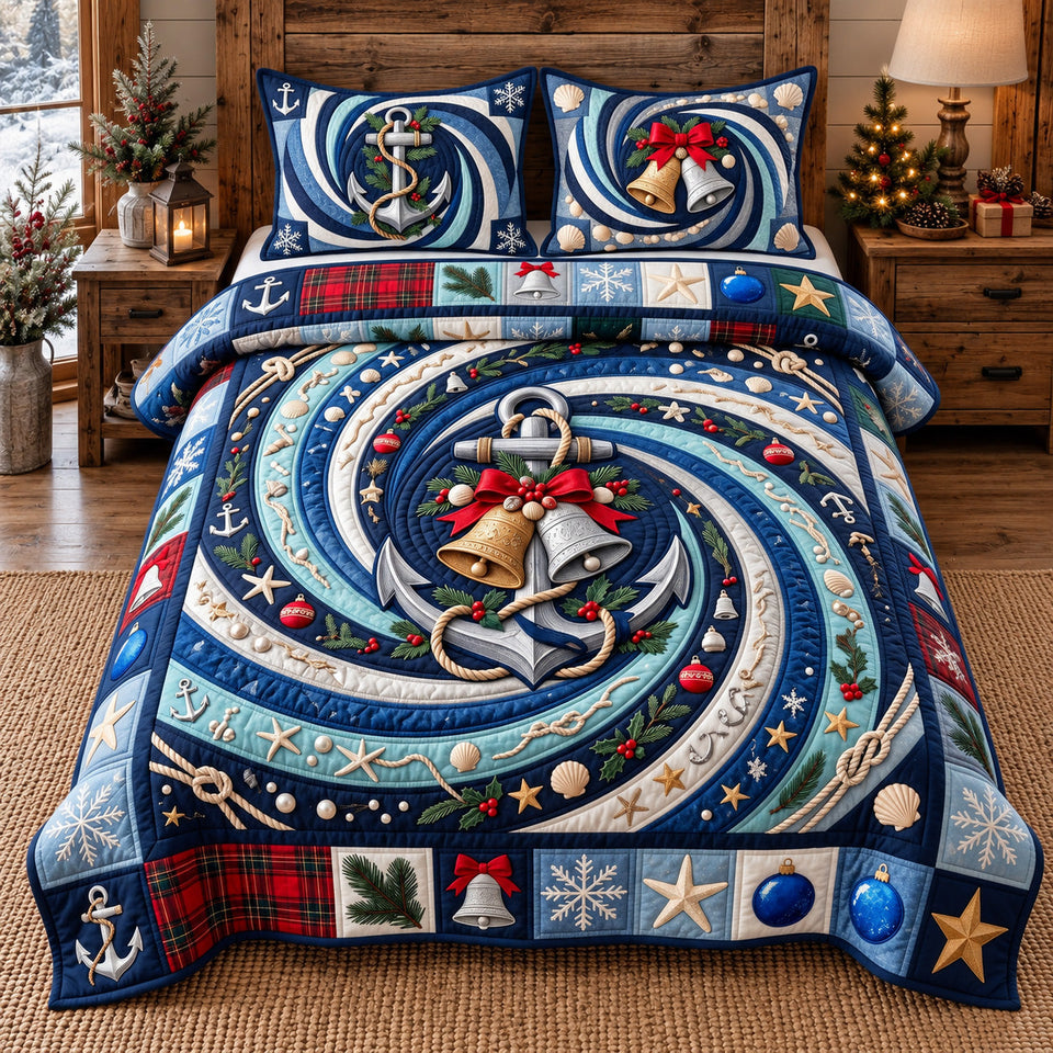 Festive Anchor Bells quilted bedding set, quilt and two pillow shams on a made bed