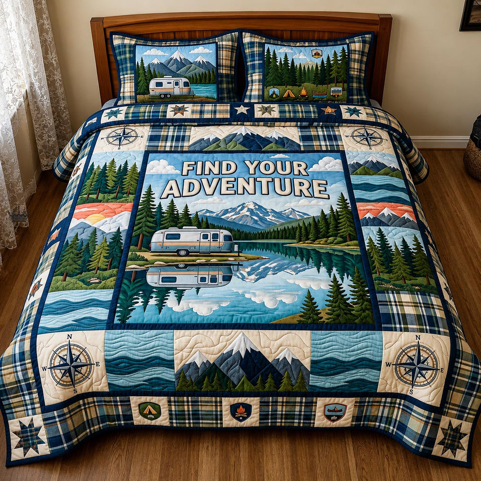Find Your Adventure Lake quilted bedding set, quilt and two pillow shams on a made bed