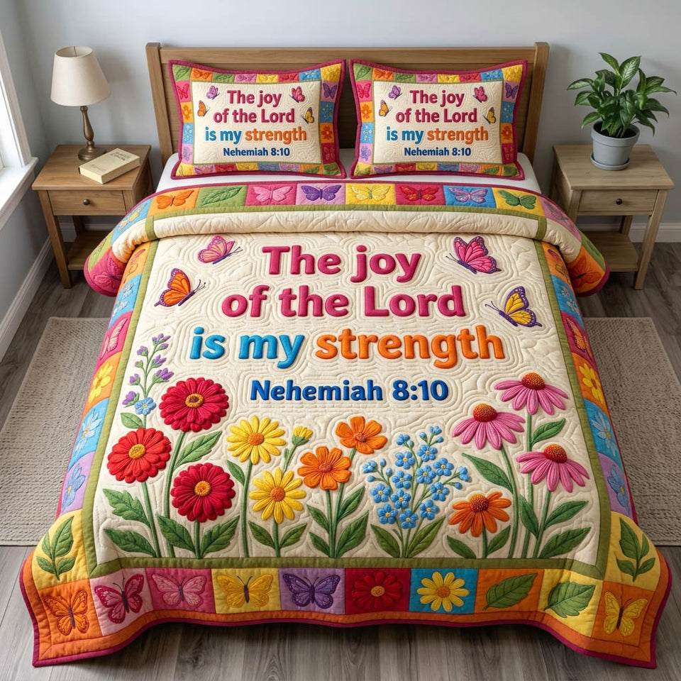 Floral Bible Bright Blossom Squares quilted bedding set, quilt and two pillow shams on a made bed