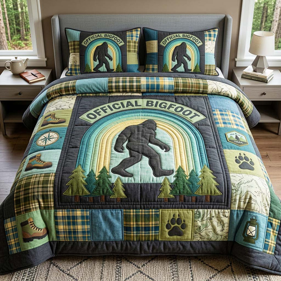 Forest Badge quilted bedding set, quilt and two pillow shams on a made bed