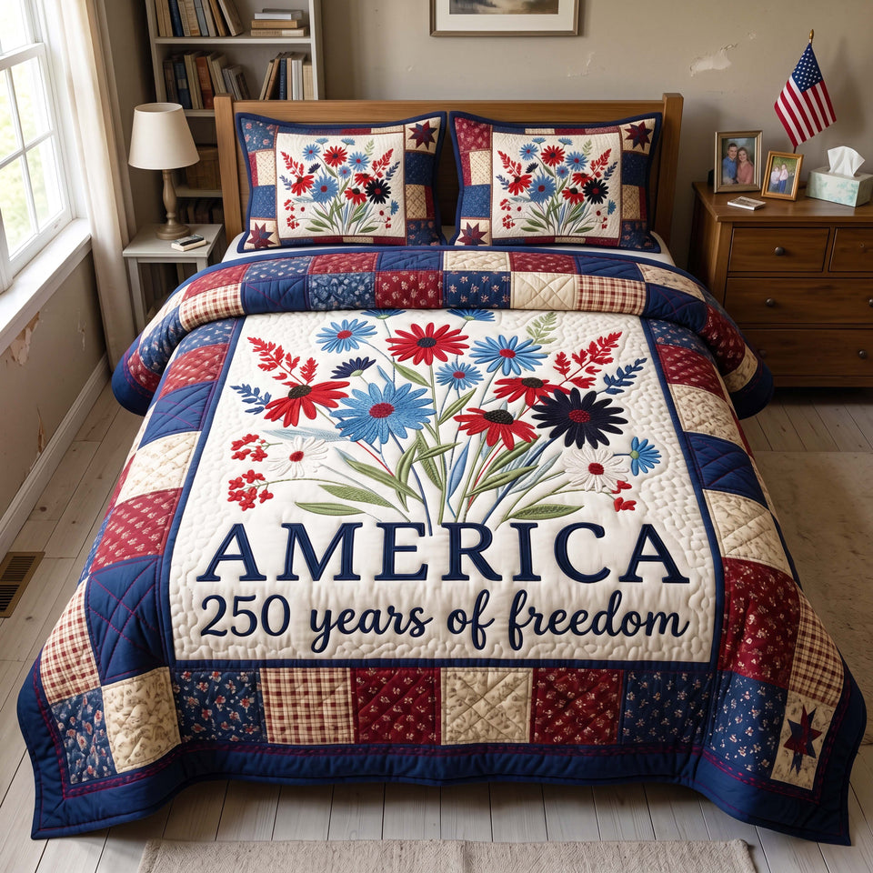 Freedom Bouquet America Wildflowers quilted bedding set, quilt and two pillow shams on a made bed