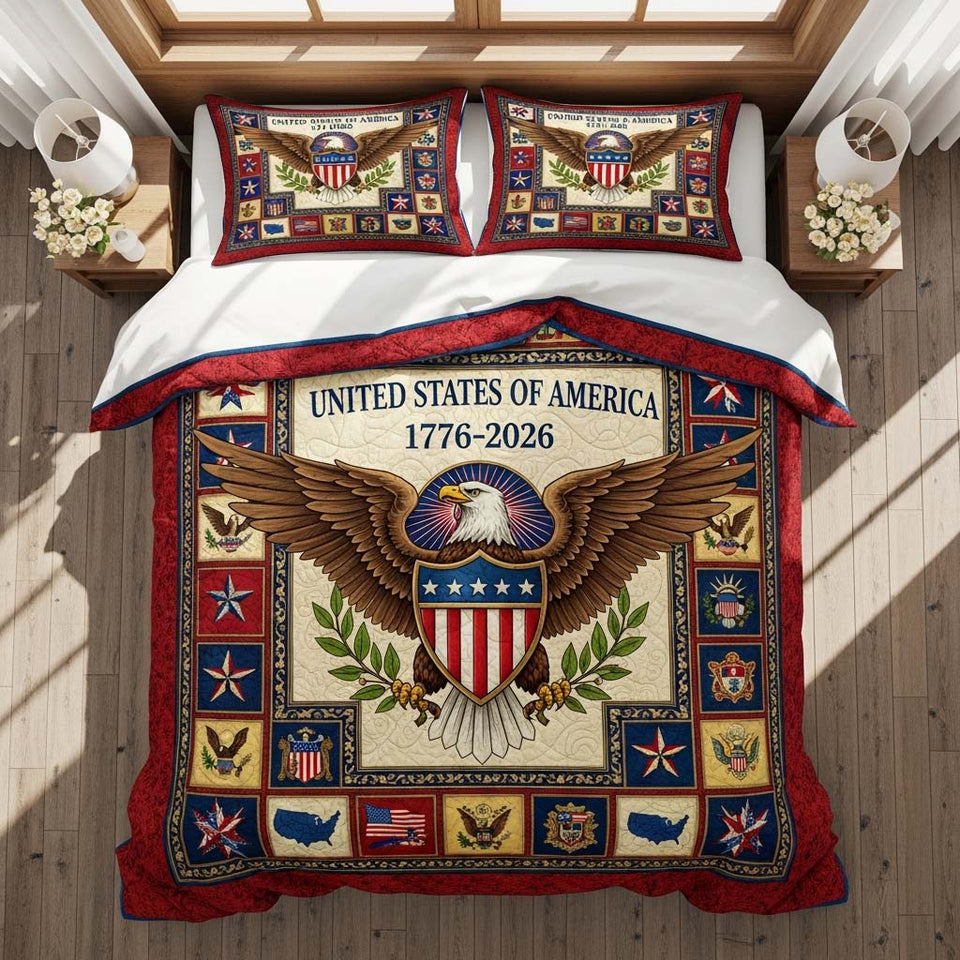 Freedom Emblem quilted bedding set, quilt and two pillow shams on a made bed
