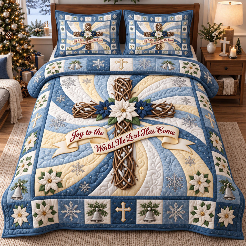 Frosty Joy Cross quilted bedding set, quilt and two pillow shams on a made bed