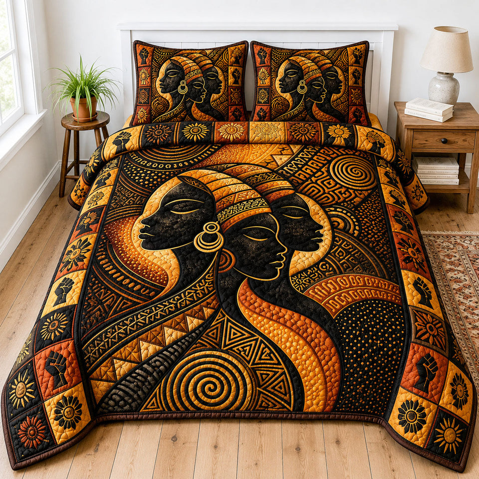 Golden Tribal Queens quilted bedding set, quilt and two pillow shams on a made bed
