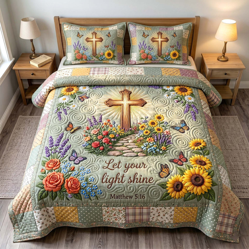 Grace In Bloom Wooden Cross and Sunflowers quilted bedding set, quilt and two pillow shams on a made bed