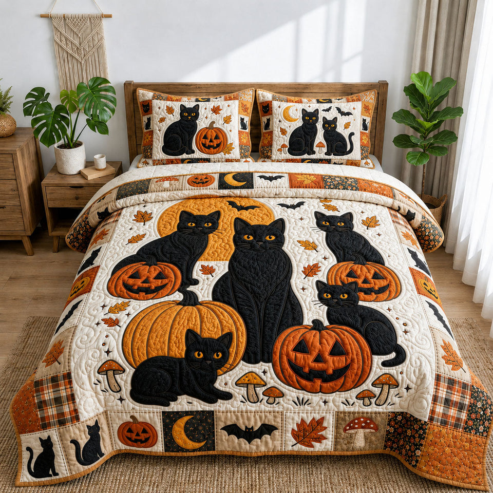 Halloween Black Cats Pumpkin Patch Trio quilted bedding set, quilt and two pillow shams on a made bed