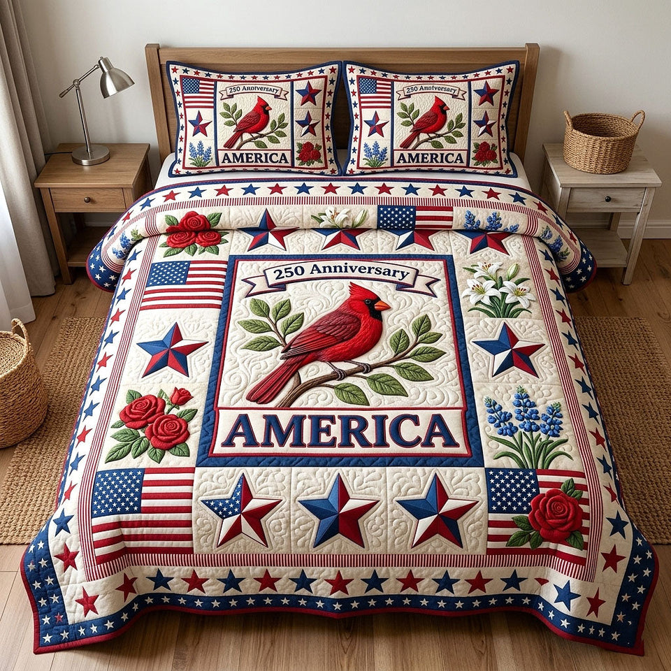 Heritage Patch Cardinal And Red Roses quilted bedding set, quilt and two pillow shams on a made bed
