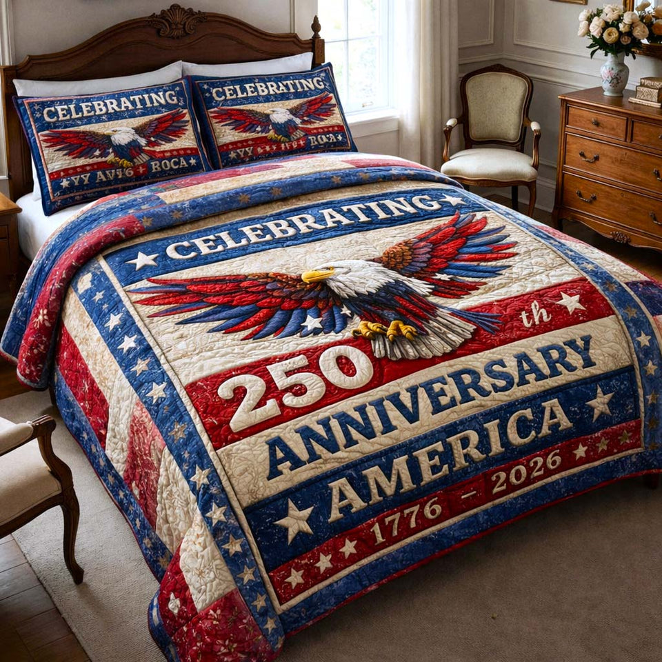 Heritage Patch Celebrating Ribbon Eagle quilted bedding set, quilt and two pillow shams on a made bed