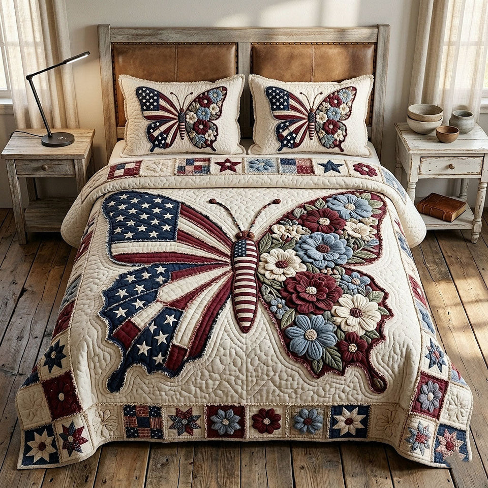 Heritage Patch Flag Winged Butterfly quilted bedding set, quilt and two pillow shams on a made bed