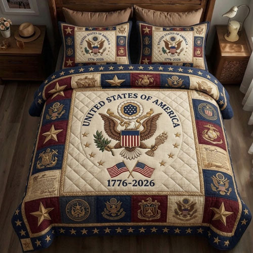 Heritage Patch Patriotic quilted bedding set, quilt and two pillow shams on a made bed