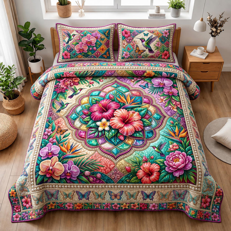 Hibiscus Jewel Mandala quilted bedding set, quilt and two pillow shams on a made bed