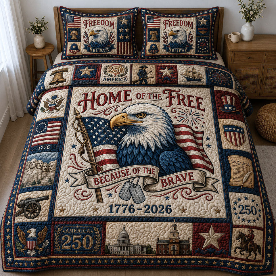 Home Of The Free quilted bedding set, quilt and two pillow shams on a made bed