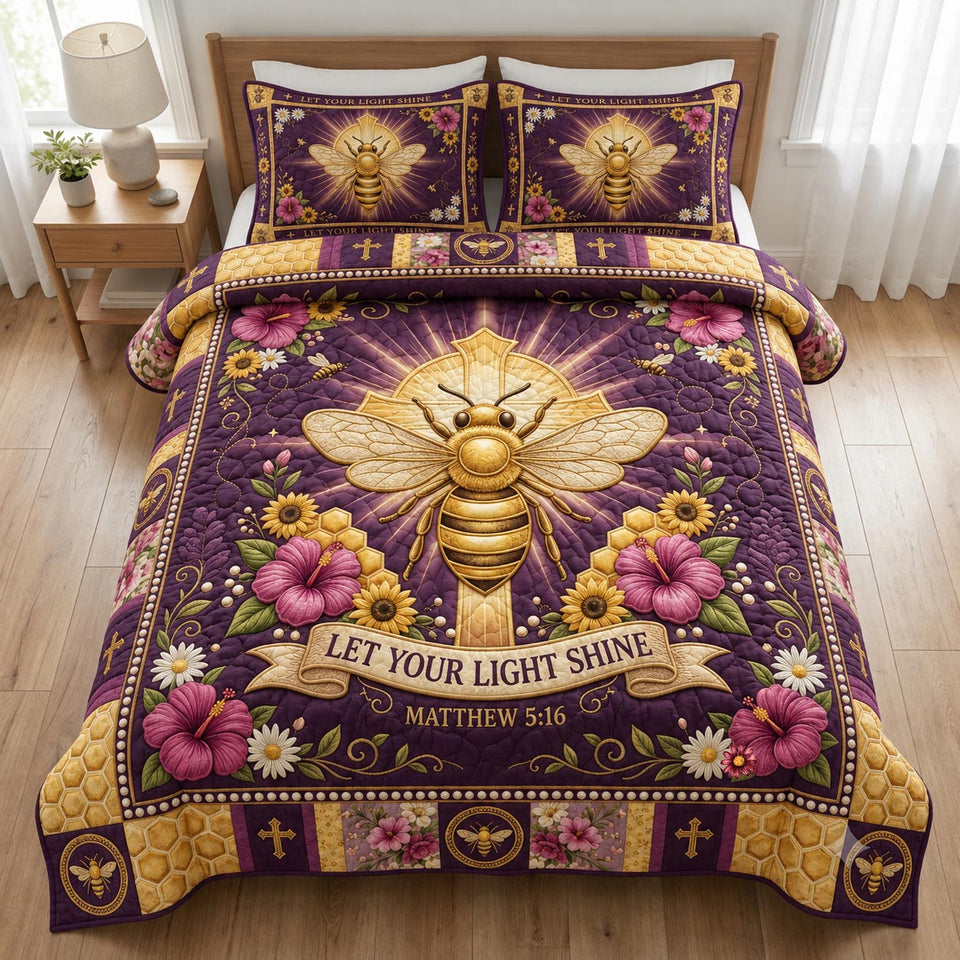 Honey Bloom quilted bedding set, quilt and two pillow shams on a made bed