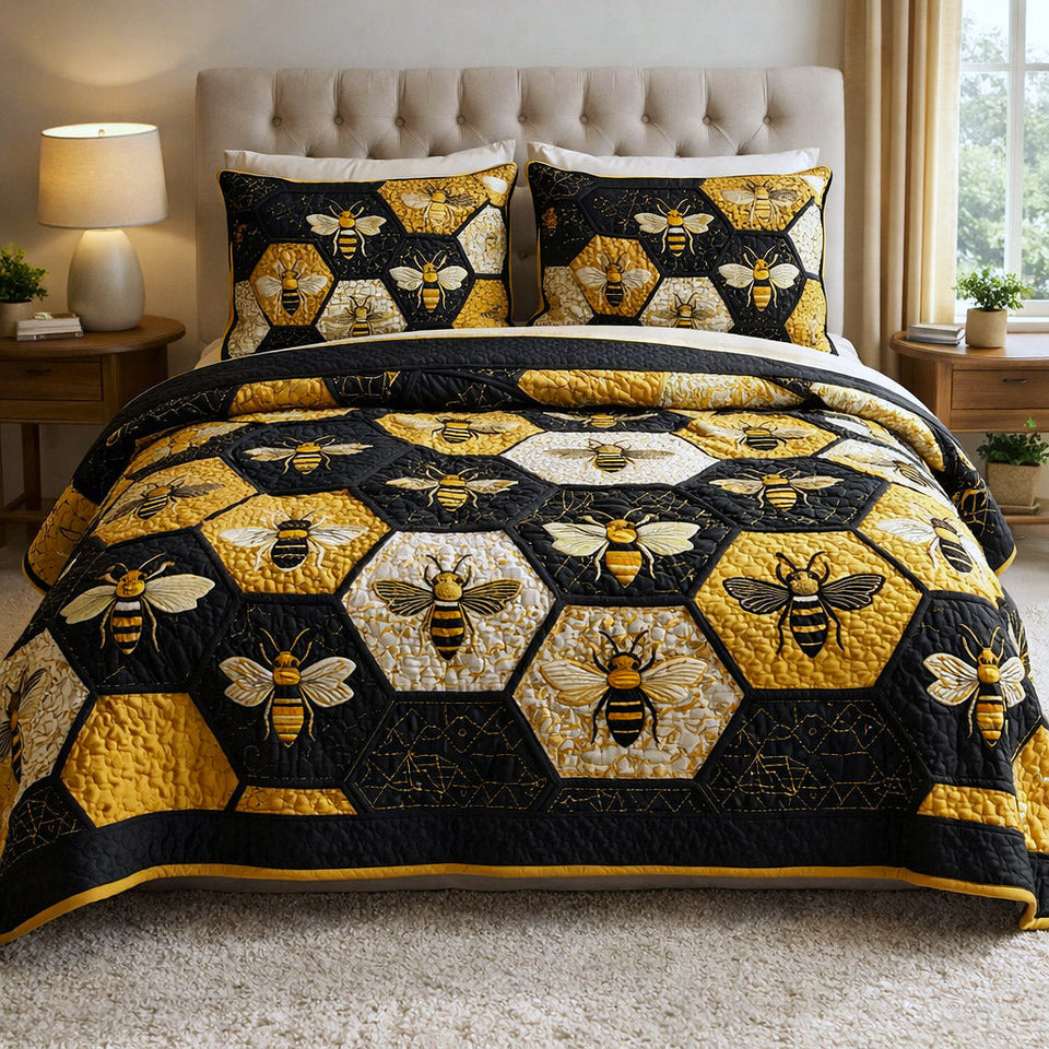 Honey Buzz Honeycomb Hexagon Grid quilted bedding set, quilt and two pillow shams on a made bed