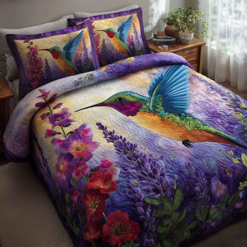 Hummingbird Haven Lavender Field quilted bedding set, quilt and two pillow shams on a made bed