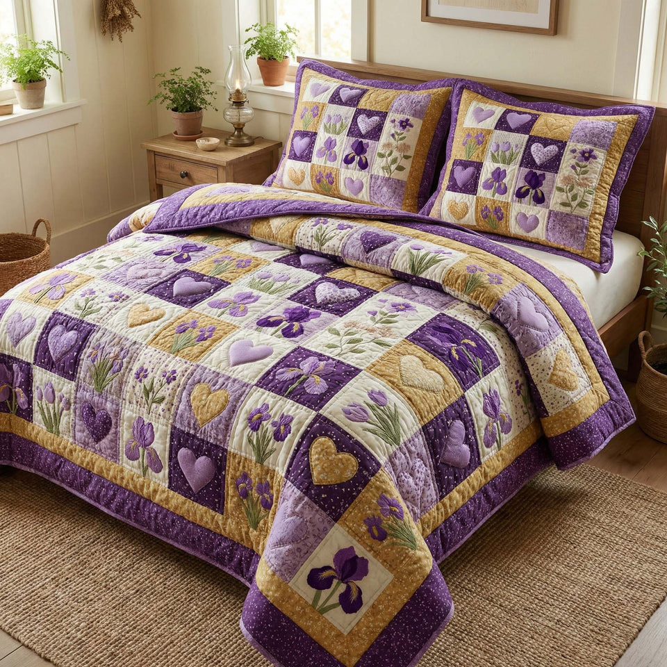 Iris Hearts quilted bedding set, quilt and two pillow shams on a made bed