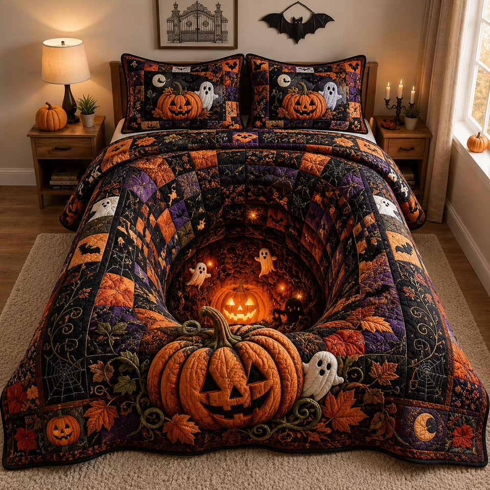 Jack Lantern Hollow Glow quilted bedding set, quilt and two pillow shams on a made bed