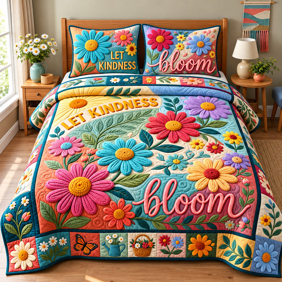 Let Kindness Bloom quilted bedding set, quilt and two pillow shams on a made bed