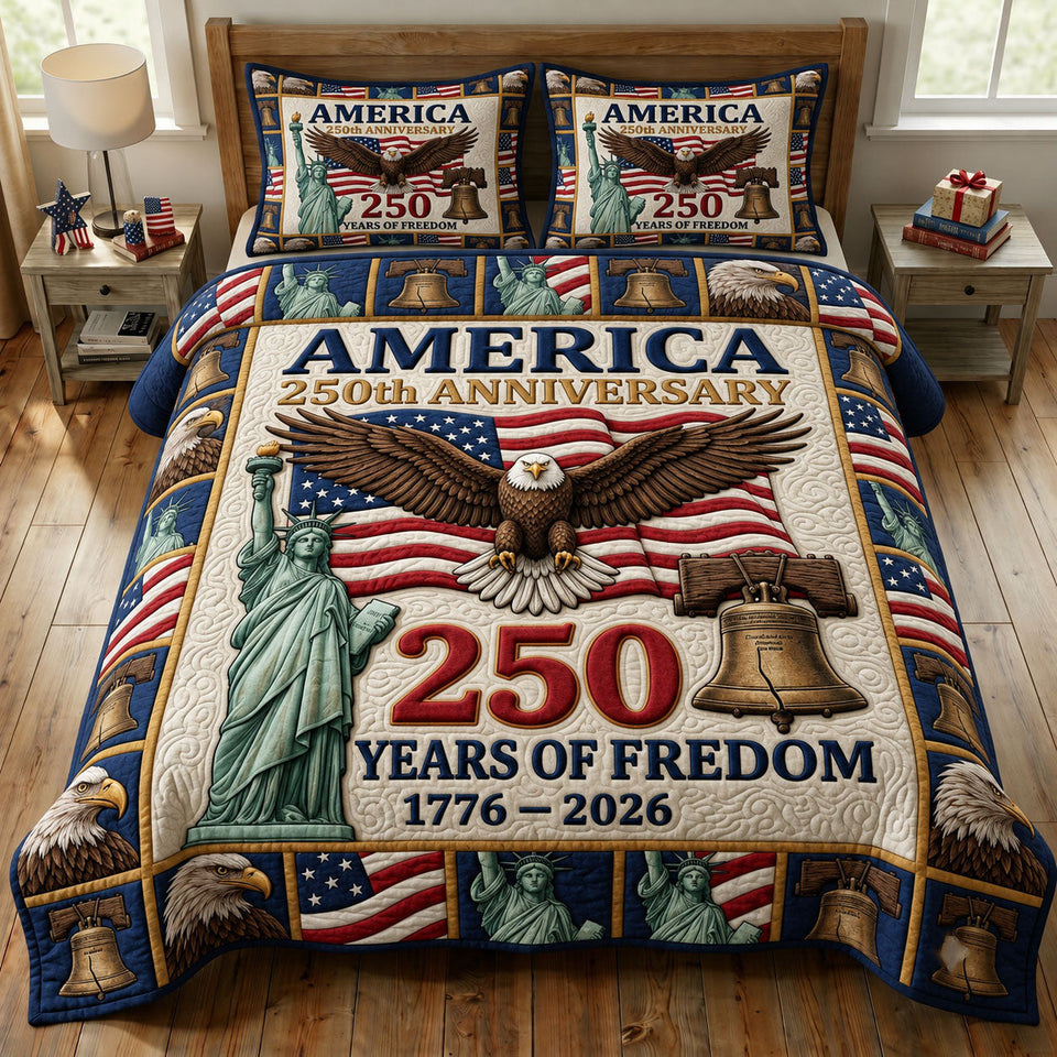 Liberty Bell Anniversary Eagle quilted bedding set, quilt and two pillow shams on a made bed