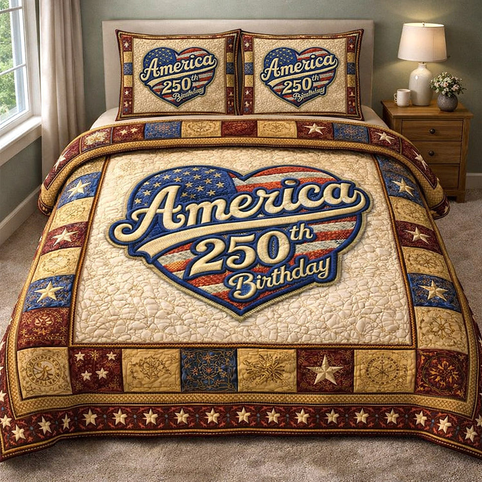 Liberty Legacy Cream Badge Birthday quilted bedding set, quilt and two pillow shams on a made bed