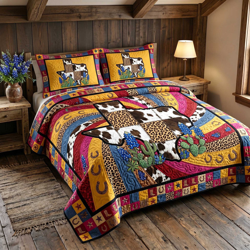 Lone Star Legacy Cowhide and Leopard Blocks quilted bedding set, quilt and two pillow shams on a made bed