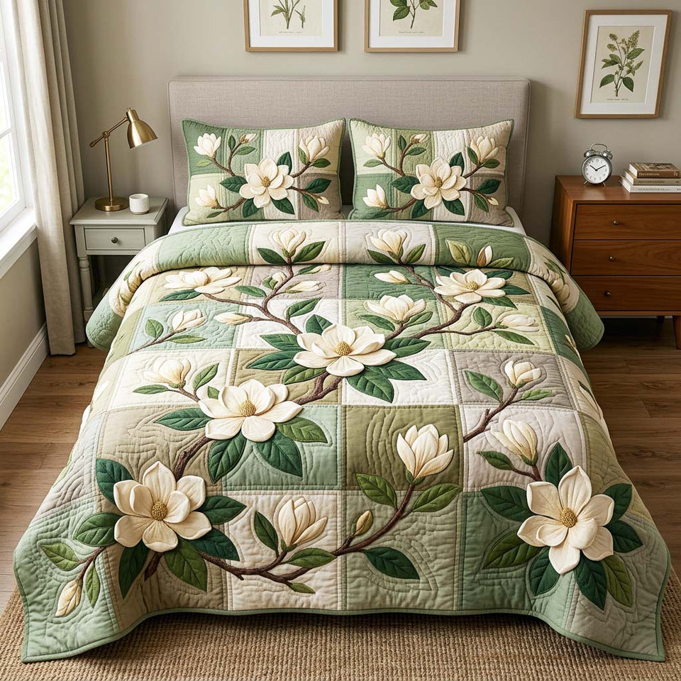 Magnolia Patch Garden quilted bedding set, quilt and two pillow shams on a made bed