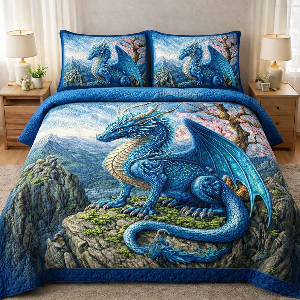 Majestic Dragon Blue Cliff Perch quilted bedding set, quilt and two pillow shams on a made bed