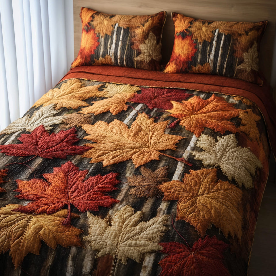 Maple Leaf Cascade quilted bedding set, quilt and two pillow shams on a made bed