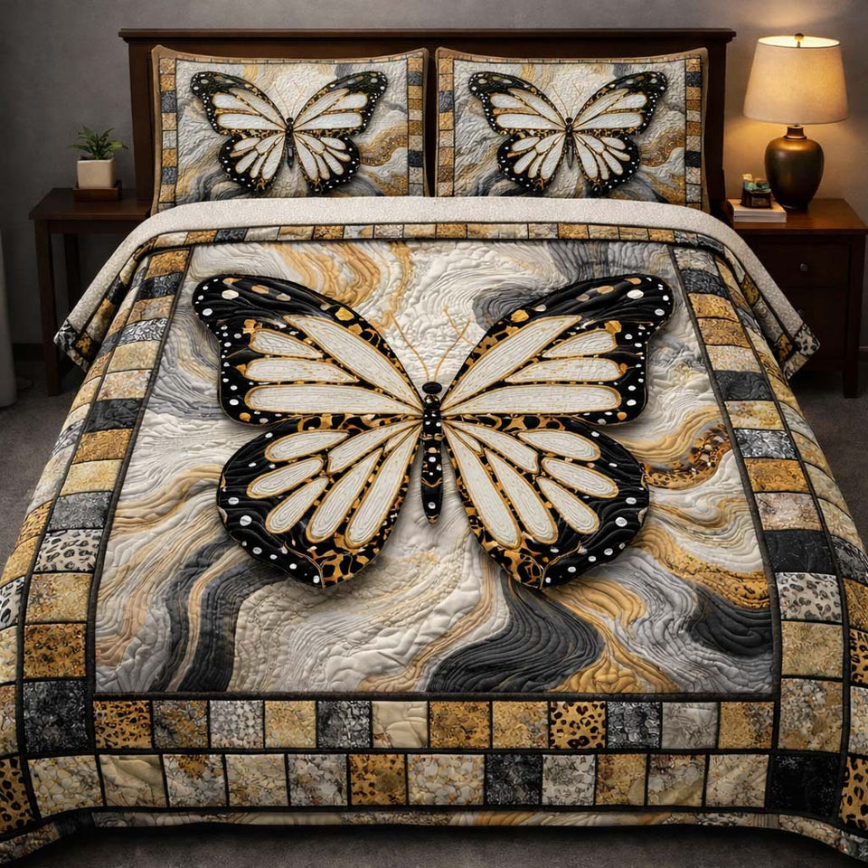 Marble Monarch Elegance quilted bedding set, quilt and two pillow shams on a made bed
