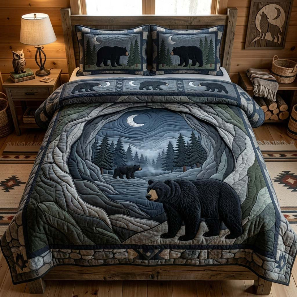 Midnight Bear Cave quilted bedding set, quilt and two pillow shams on a made bed