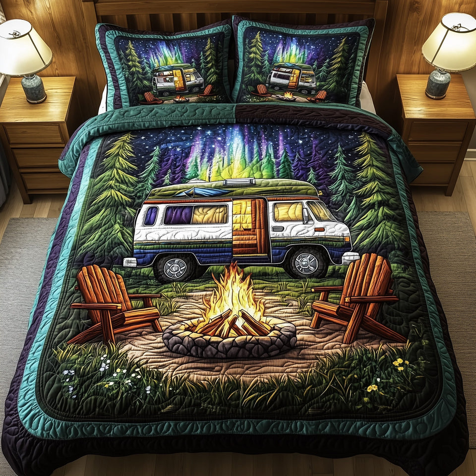 Midnight Camping quilted bedding set, quilt and two pillow shams on a made bed
