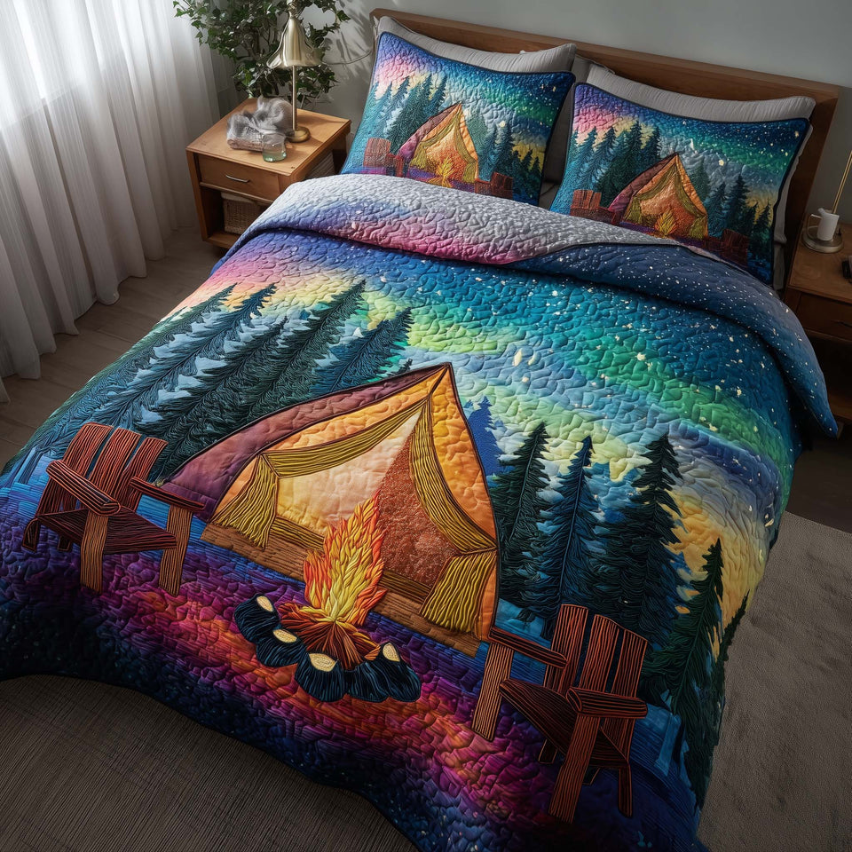 Midnight Harmony Glowing Tent Aurora quilted bedding set, quilt and two pillow shams on a made bed