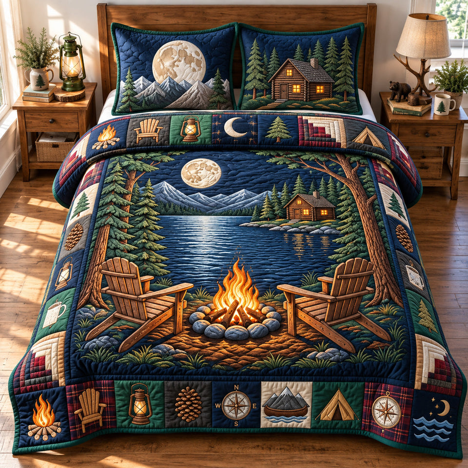 Midnight Lake quilted bedding set, quilt and two pillow shams on a made bed
