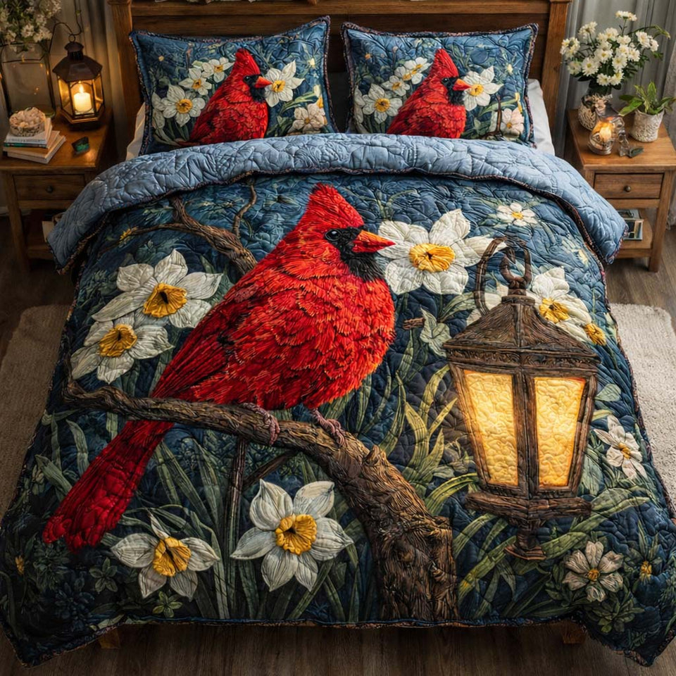Midnight Lantern Cardinal quilted bedding set, quilt and two pillow shams on a made bed