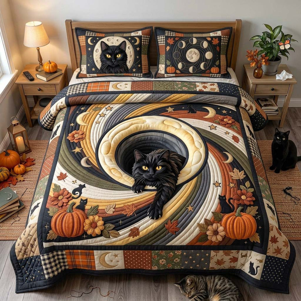 Moon Cat Spiral quilted bedding set, quilt and two pillow shams on a made bed