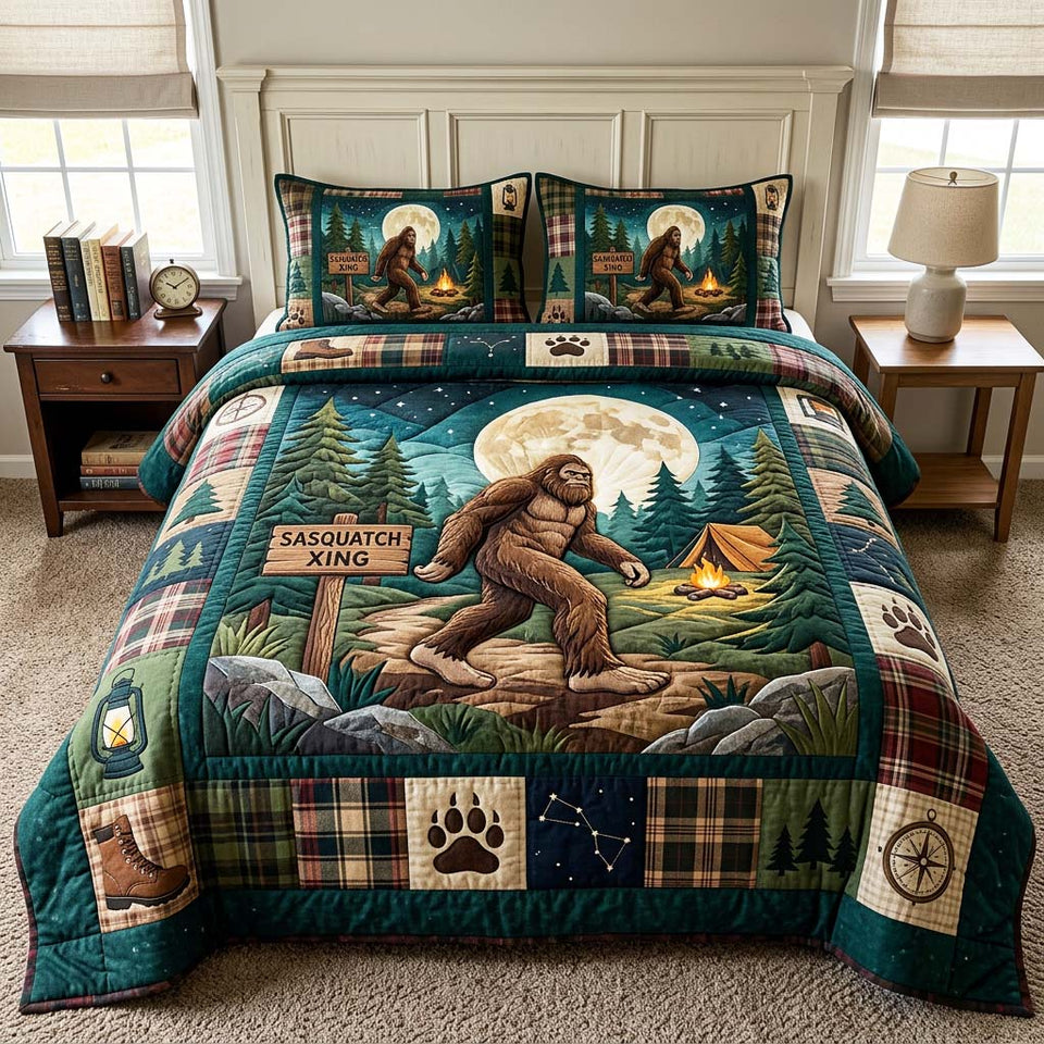 Moon Sasquatch quilted bedding set, quilt and two pillow shams on a made bed