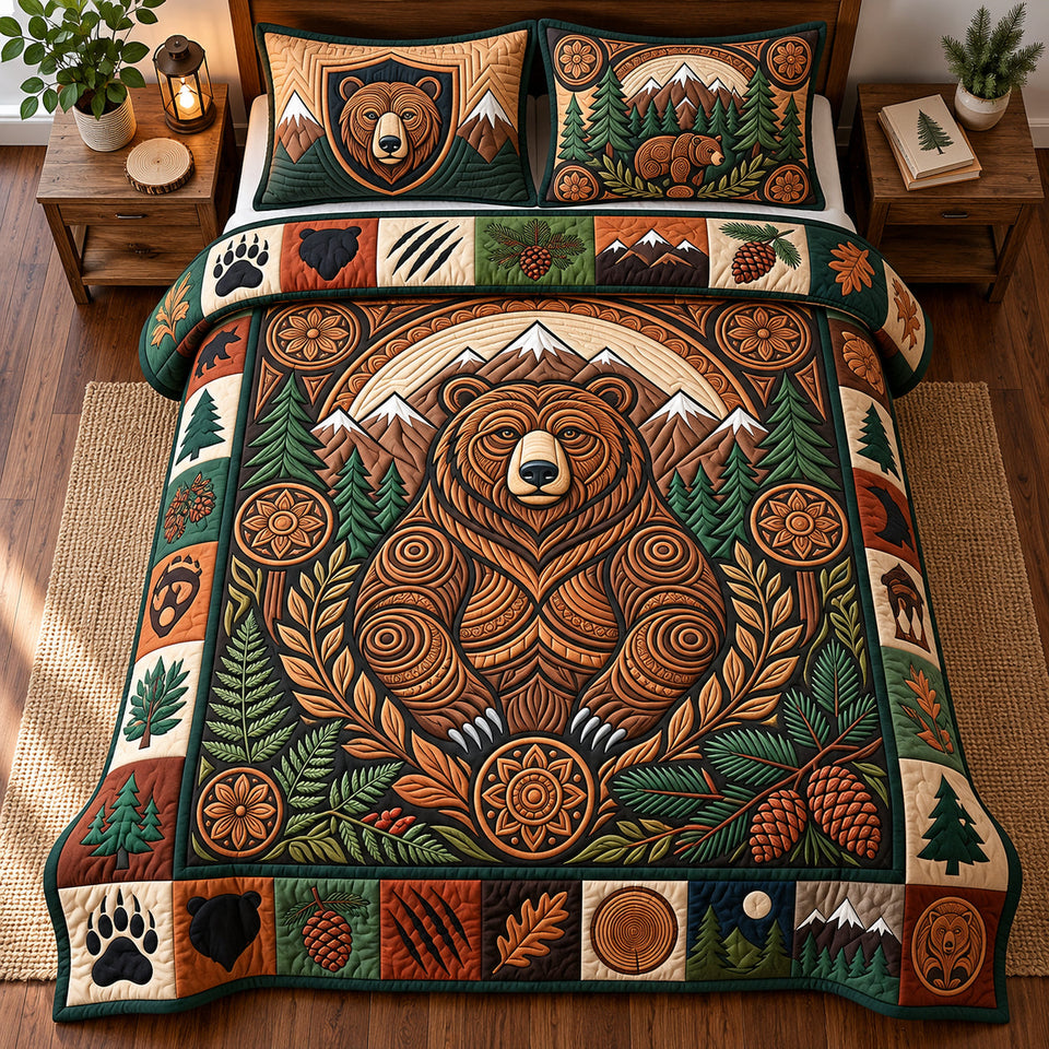 Mountain Bear quilted bedding set, quilt and two pillow shams on a made bed