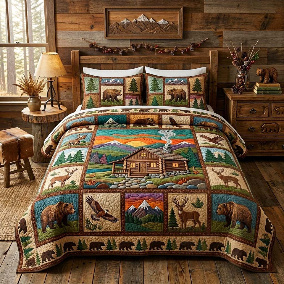 Mountain Cabin quilted bedding set, quilt and two pillow shams on a made bed
