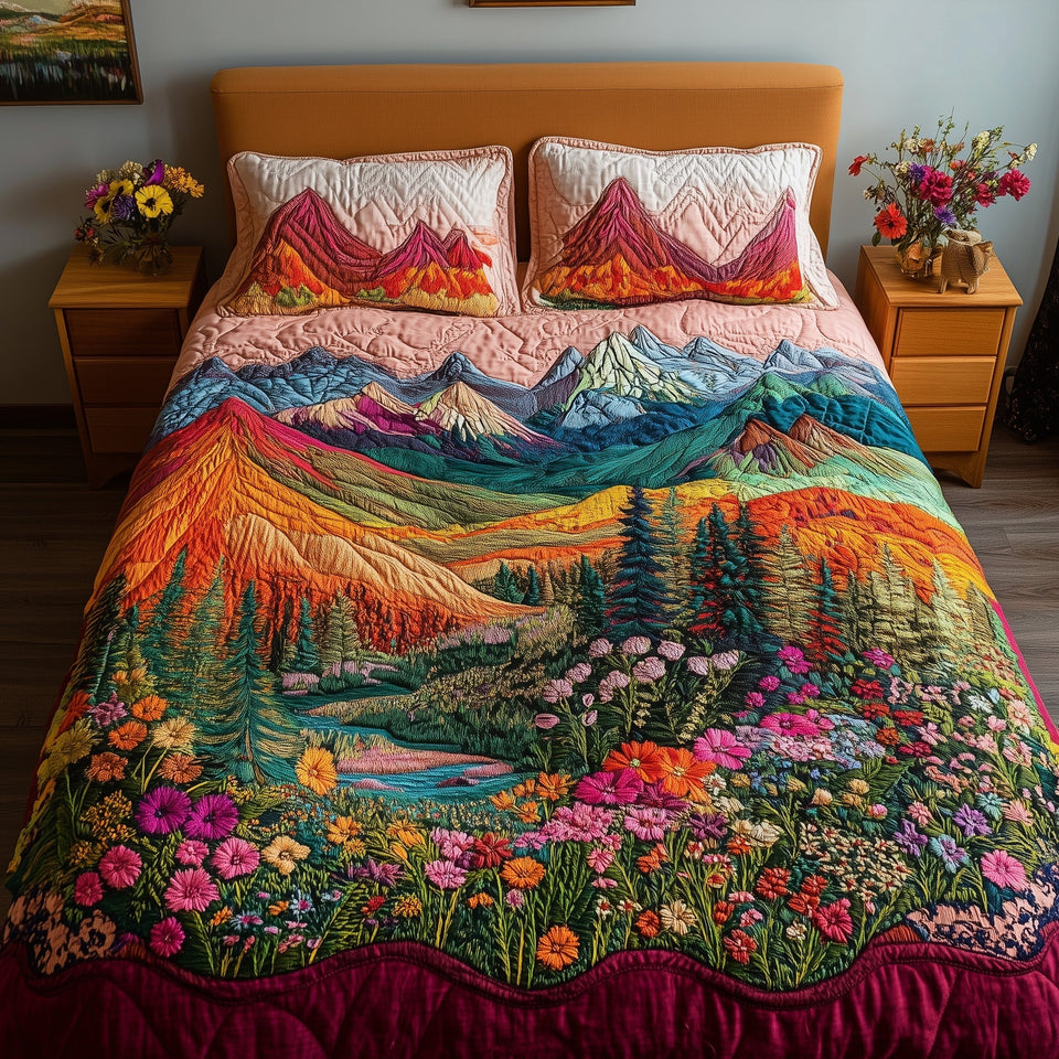 Mountain's Embrace Orange and Teal Range quilted bedding set, quilt and two pillow shams on a made bed