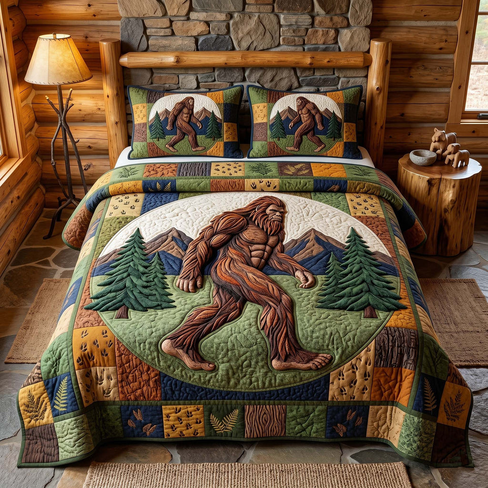 Mystic Sasquatch Oval Panel with Pines quilted bedding set, quilt and two pillow shams on a made bed