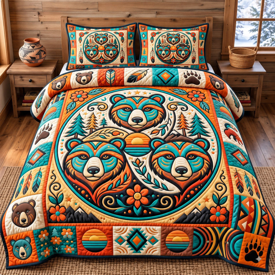 Native Bear quilted bedding set, quilt and two pillow shams on a made bed