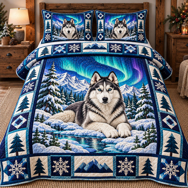 Northern Lights Husky quilted bedding set, quilt and two pillow shams on a made bed