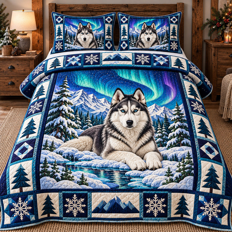 Northern Lights Husky quilted bedding set, quilt and two pillow shams on a made bed