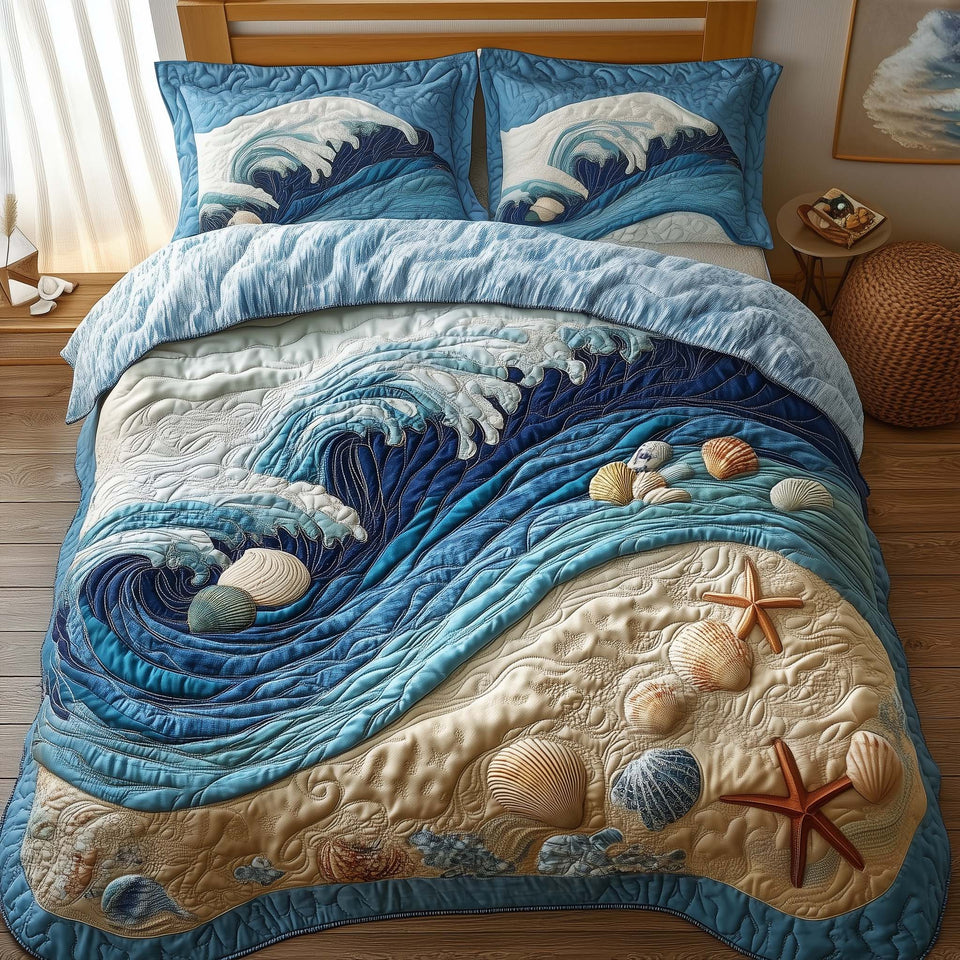 Ocean Breeze Rolling Surf Shoreline quilted bedding set, quilt and two pillow shams on a made bed