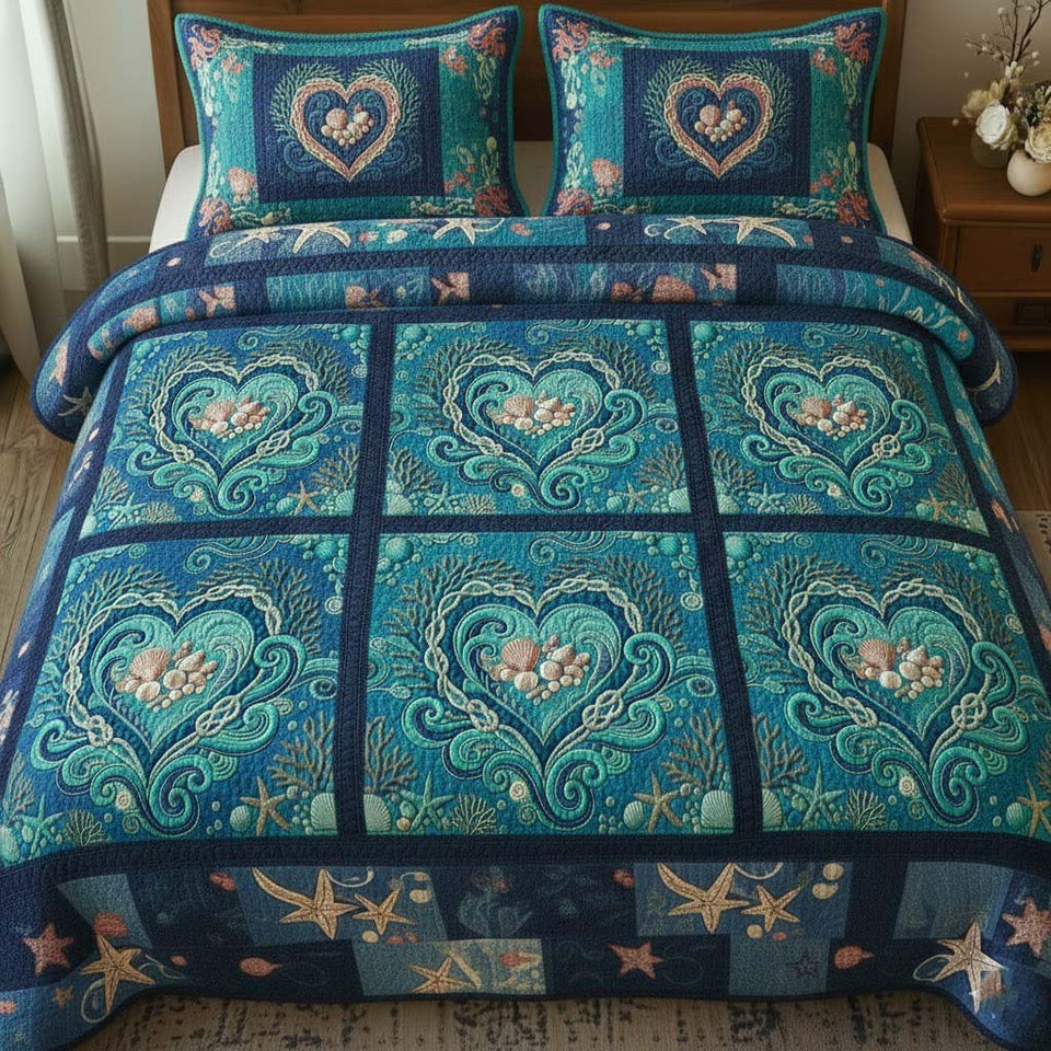 Ocean Breeze Teal Heart Blocks quilted bedding set, quilt and two pillow shams on a made bed