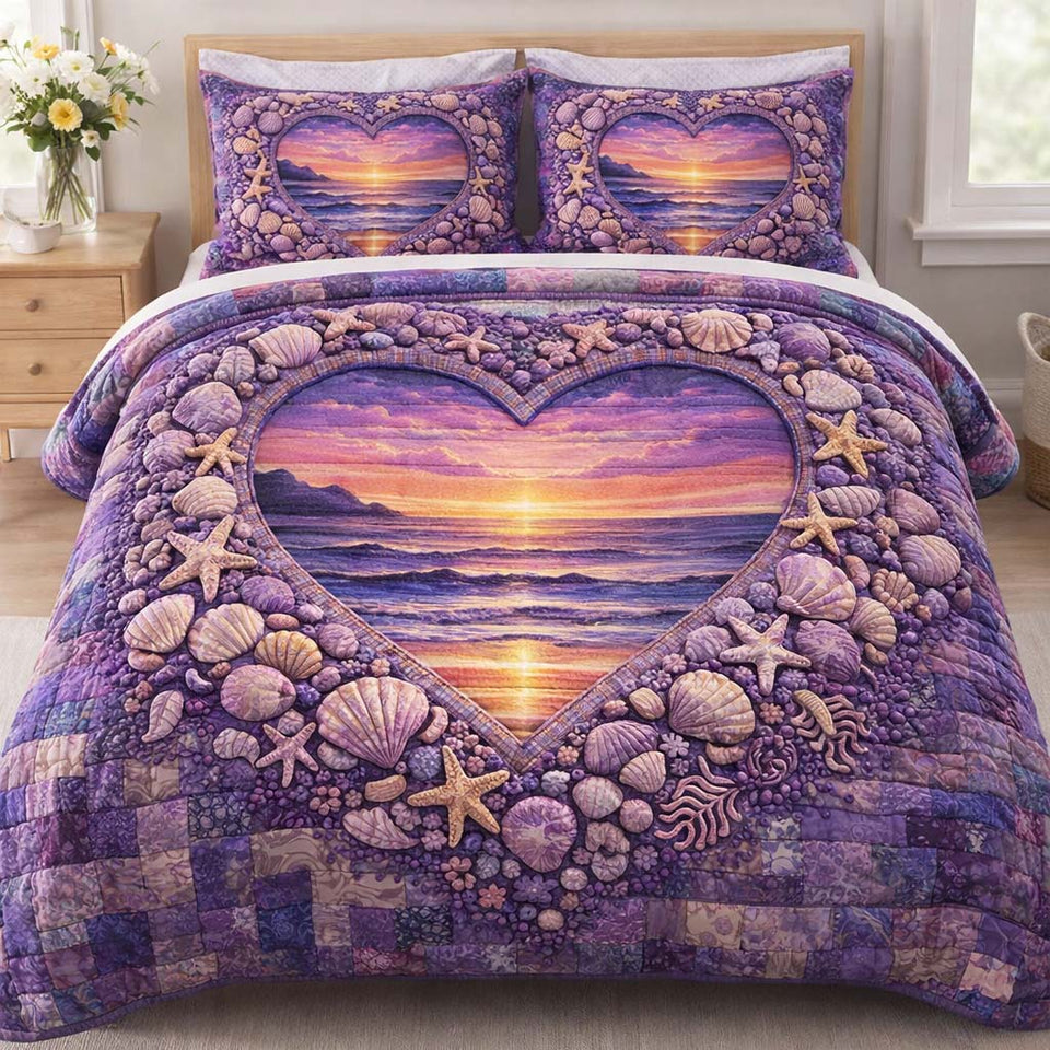 Ocean Heart quilted bedding set, quilt and two pillow shams on a made bed