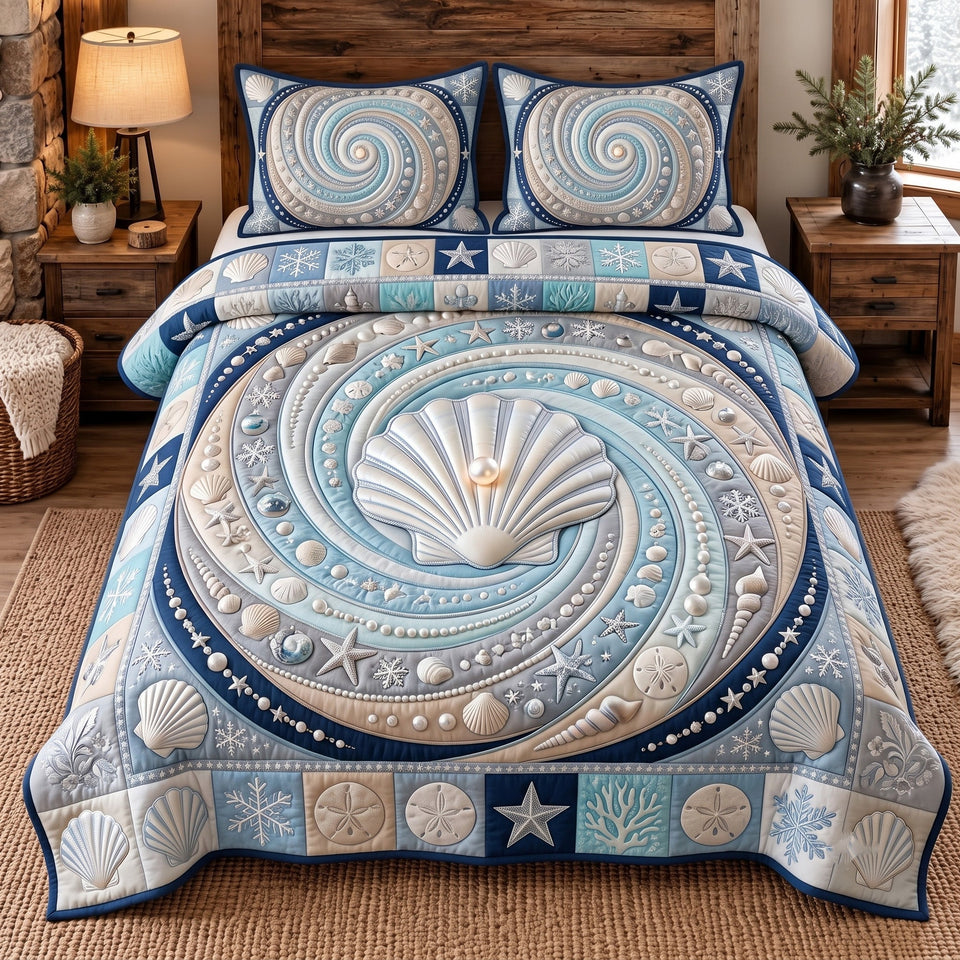 Ocean Pearl Shell quilted bedding set, quilt and two pillow shams on a made bed